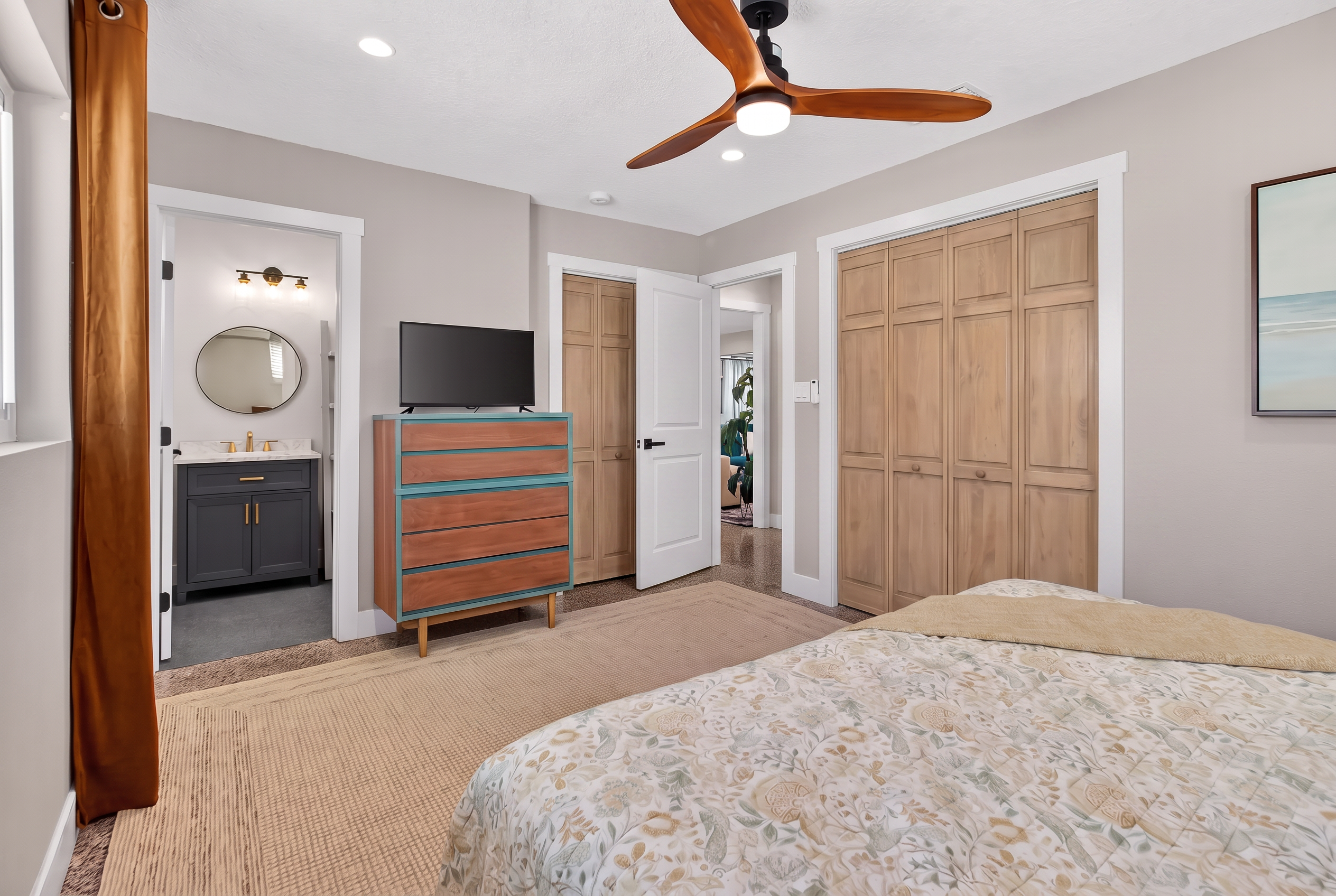 Primary bedroom with en-suite bath and calm neutral palette